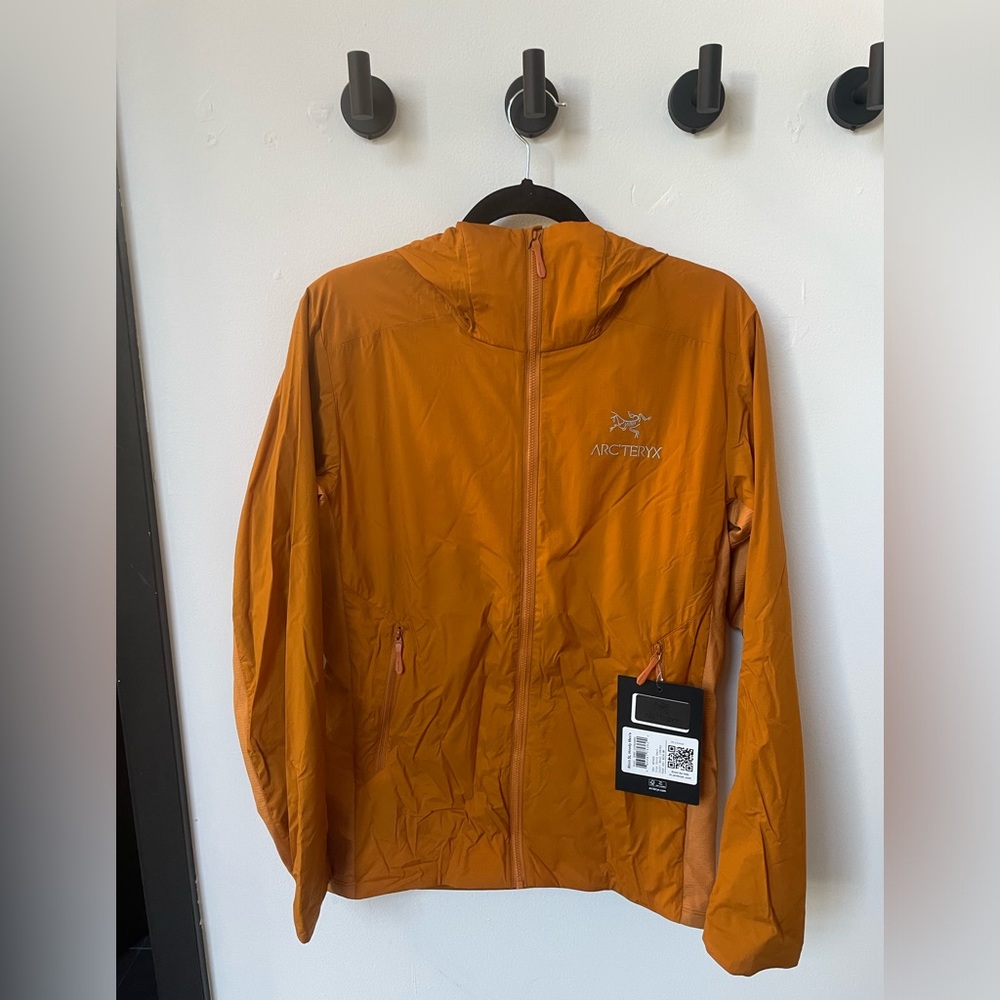 Brand new never worn Atom SL hoody men’s orange jacket. Size XS.